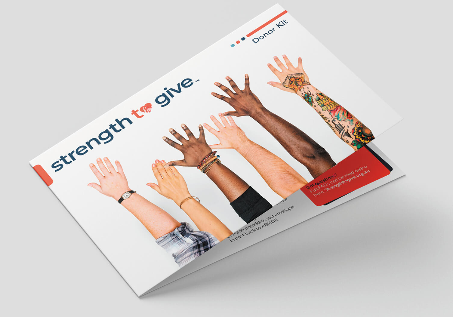 Strength2Give folded brochure mockup displaying campaign materials and brand applications